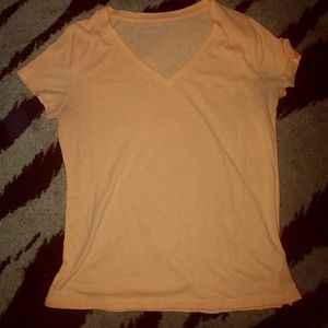 Peachy/orange colored T-shirt